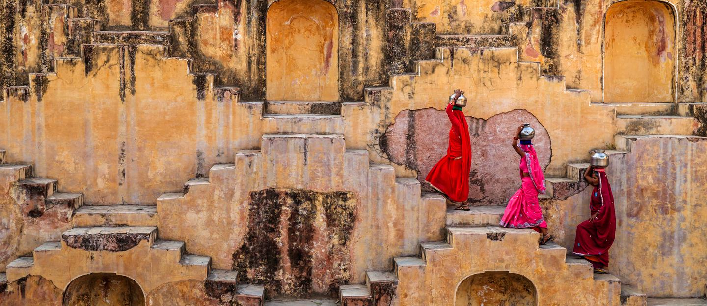 Indian woman walking up stairs